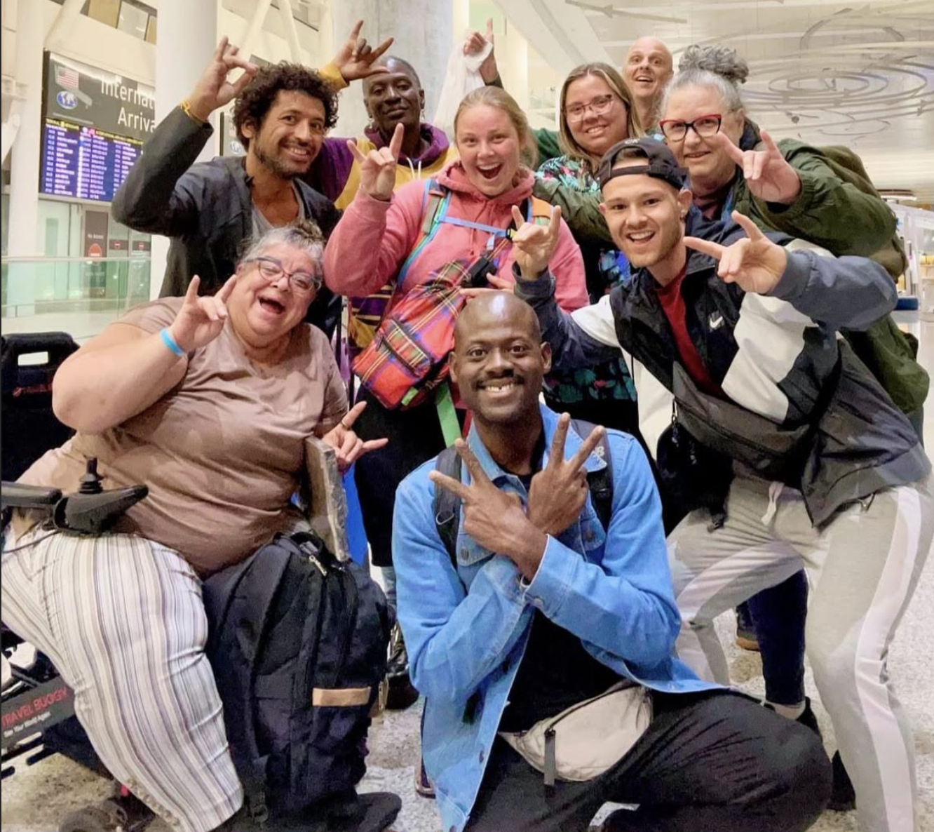 Robert and his coworkers in an airport.