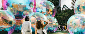 Inflatable bubbles resembling shiny buildings, dubbed as "art-chitecture" by the artist, Atelier Sisu.