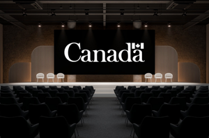 The "Canada" logo appears on a projection screen, with an empty stage of seats and an audience of chairs